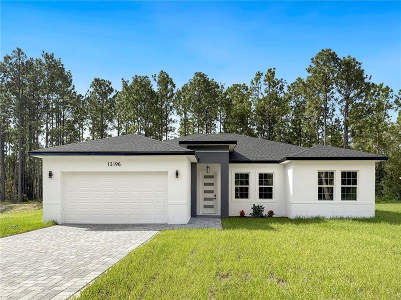 Front exterior of a new home in , Ocala, FL, highlighting curb appeal (Image 2).
