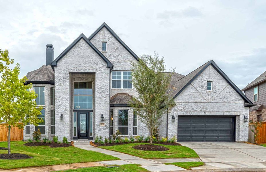 Representative exterior photo of a completed home built from the 4195 by Ravenna Homes in Artavia 70′, Conroe, TX (Image 23). Representative exterior photo of a completed home built from the 4195 by Ravenna Homes in Artavia 70′, Conroe, TX (Image 23).