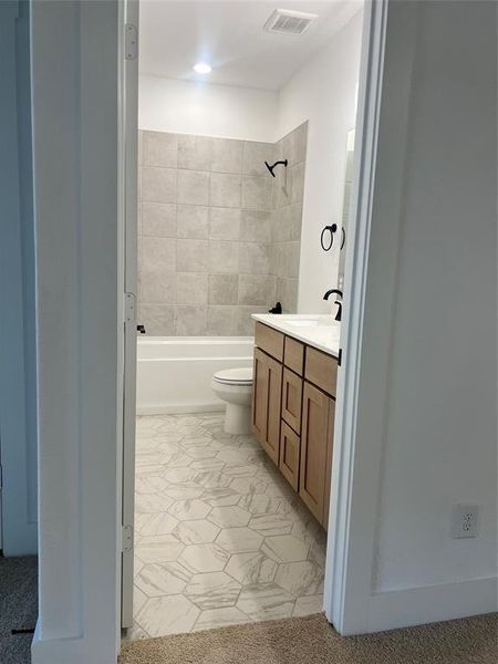 Bathroom featuring vanity and shower / bath combination
