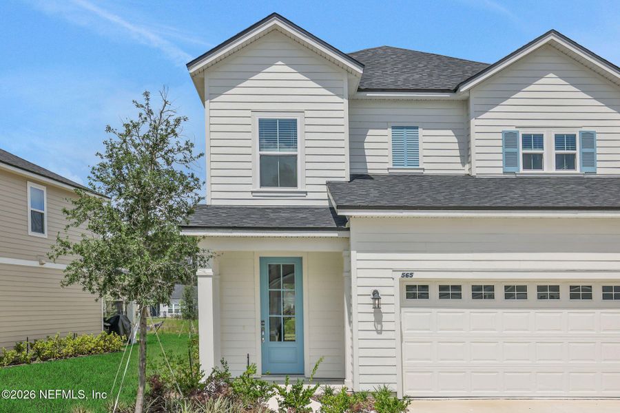 Front exterior of a new home in TrailMark, St. Augustine, FL, highlighting curb appeal (Image 30). Front exterior of a new home in TrailMark, St. Augustine, FL, highlighting curb appeal (Image 30).