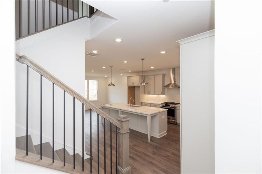 Upon entering the home, open concept, nice drop area at the front for a nice piece of furniture for keys, purses, shoes, etc. Pictures represent a previously built home, not the actual home.