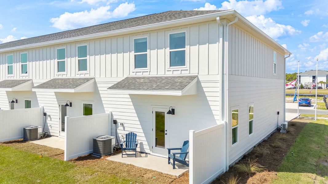 Exterior details and patio area of a home in Colonial East Townhomes, Panama City Beach (Image 3).