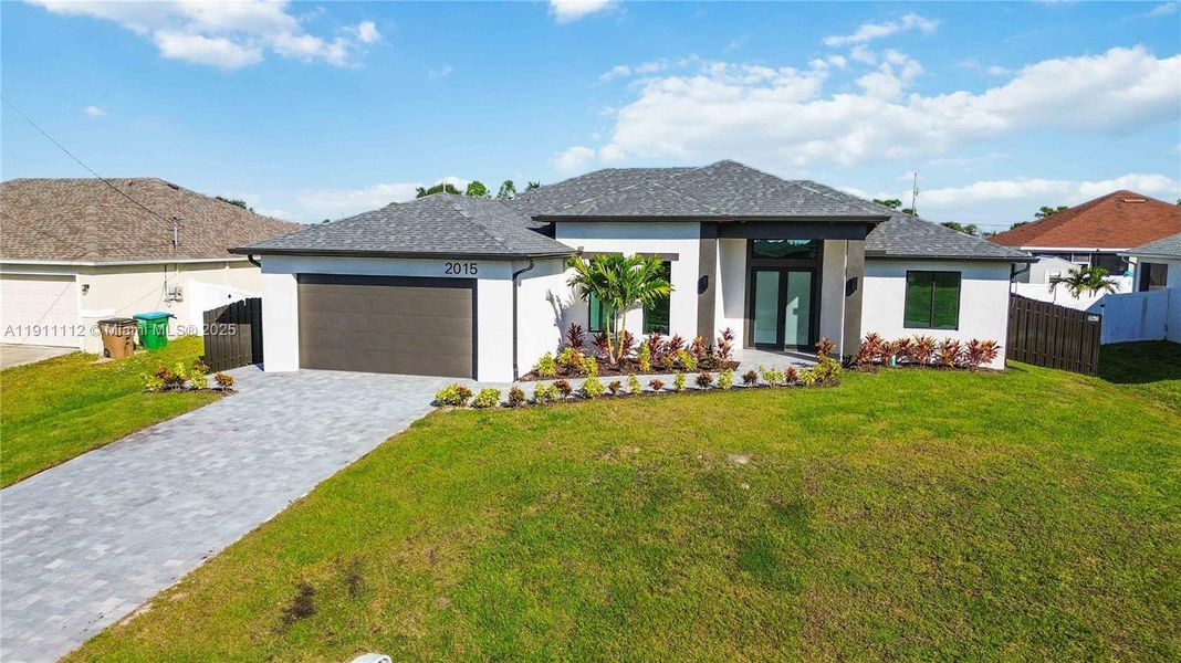 Front exterior of a new home in , Cape Coral, FL, highlighting curb appeal (Image 18). Front exterior of a new home in , Cape Coral, FL, highlighting curb appeal (Image 18).