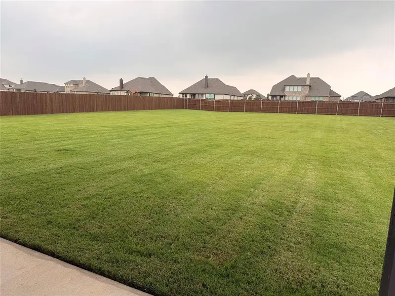 Exterior details and patio area of a home in Coyote Crossing, Godley (Image 4).