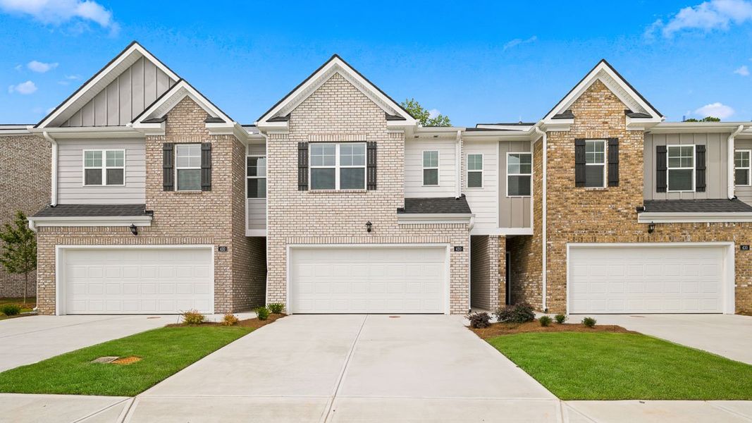 Front exterior of a new home in Independence Villas and Townhomes, Loganville, GA, highlighting curb appeal (Image 1). Front exterior of a new home in Independence Villas and Townhomes, Loganville, GA, highlighting curb appeal (Image 1).