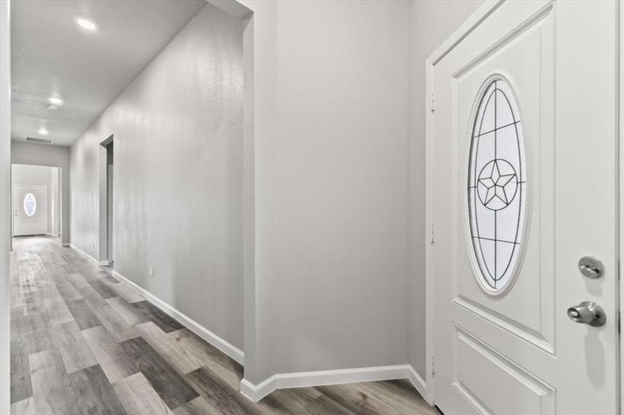 Entrance foyer featuring hardwood / wood-style floors