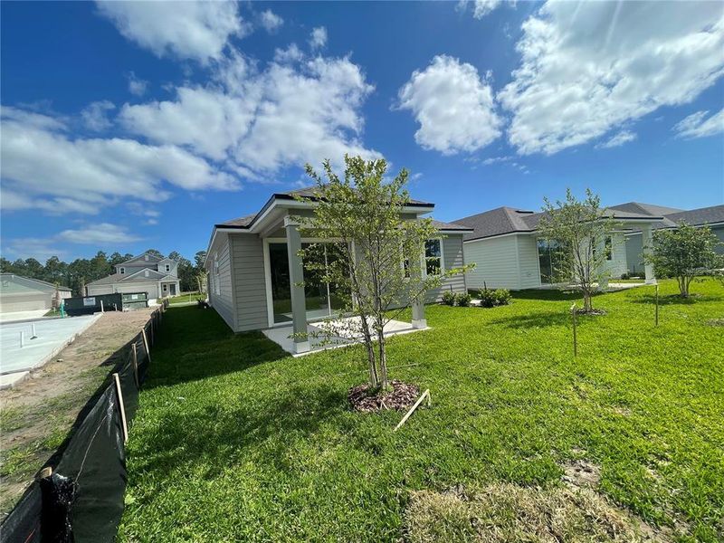 Front exterior of a new home in Palm Series at Seminole Palms, Palm Coast, FL, highlighting curb appeal (Image 17).