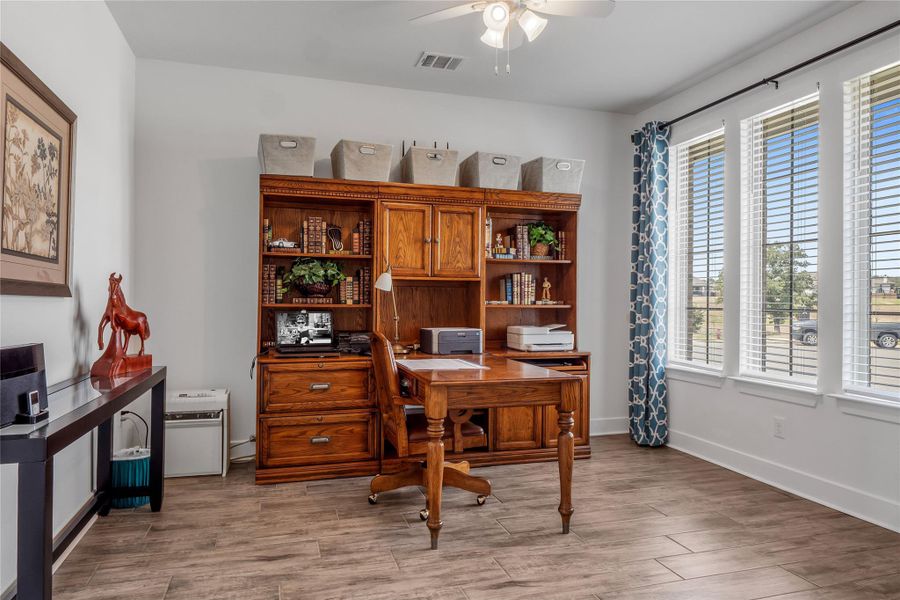 Office / Flex with light wood-style flooring and a ceiling fan Office / Flex with light wood-style flooring and a ceiling fan
