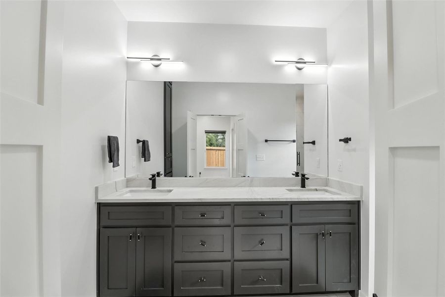 Bathroom featuring double vanity