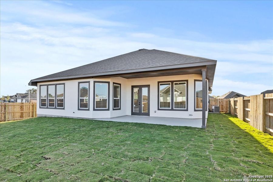 Exterior details and patio area of a home in Village at Three Oaks, Seguin (Image 4).