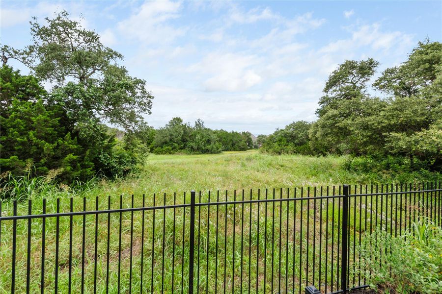 Secure yard provides peaceful green space with mature trees. Secure yard provides peaceful green space with mature trees.