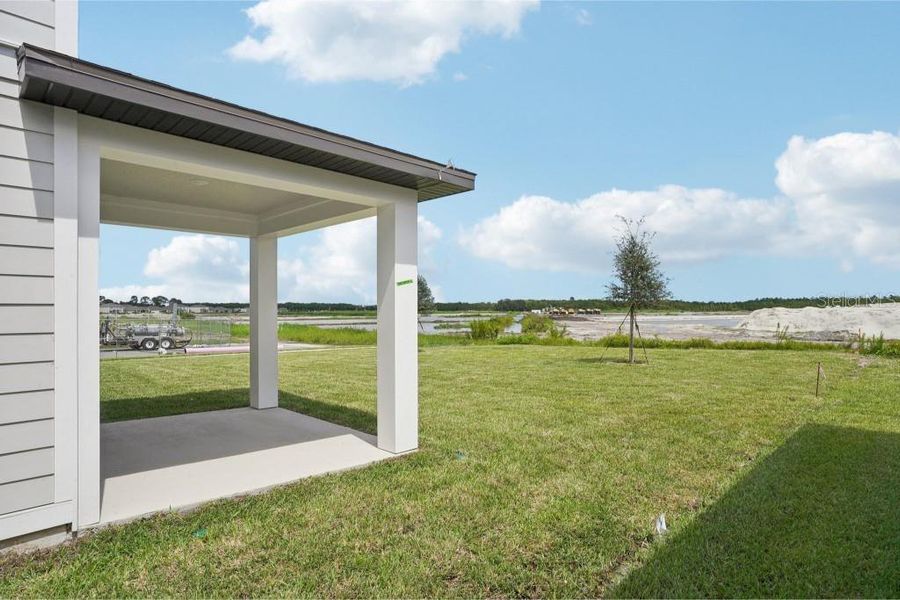Front exterior of a new home in Ardisia Park Traditional, New Smyrna Beach, FL, highlighting curb appeal (Image 16).