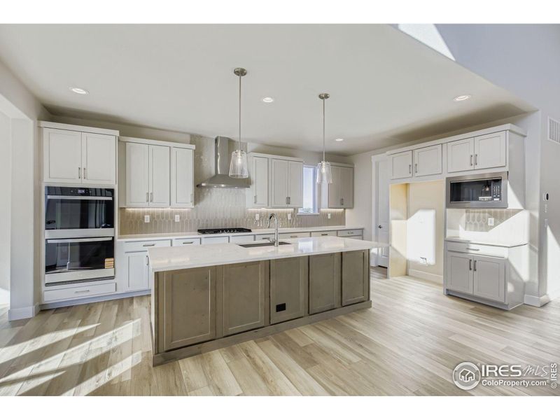 Furnished interior view inside a new home in RainDance National 60/70, Windsor (Image 7).