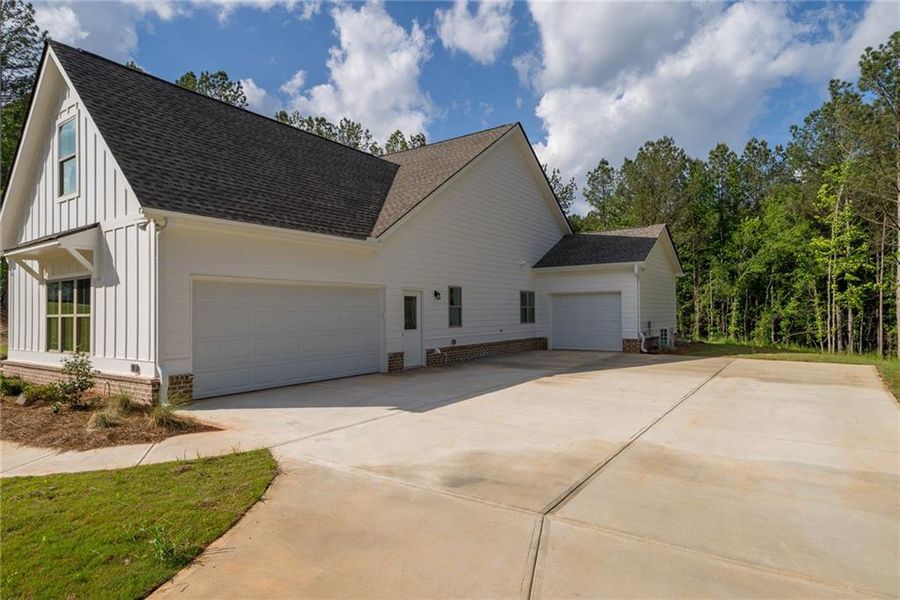 Front exterior of a new home in , Social Circle, GA, highlighting curb appeal (Image 2). Front exterior of a new home in , Social Circle, GA, highlighting curb appeal (Image 2).