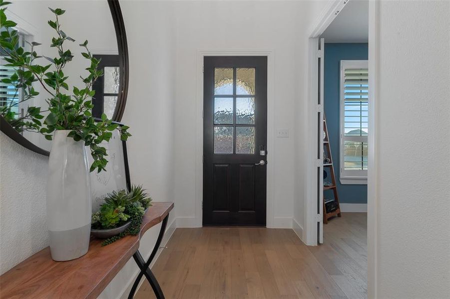 Entryway featuring light wood-style floors and baseboards