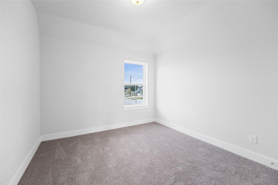 This room has many uses besides a bedroom for family and guests. Consider a playroom, media room, fitness studio or craft room to name a few. This room offers plush carpeting, ample storage space closet and a large window for natural lighting.