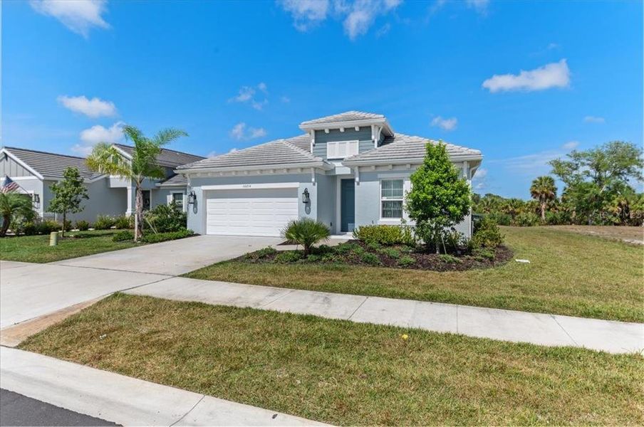 Front exterior of a new home in , Sarasota, FL, highlighting curb appeal (Image 22).