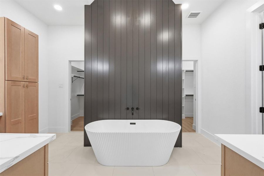 Soaking tub with standing shower. Photos are of prior LOTUS plan homesite built by Aurcova. Soaking tub with standing shower. Photos are of prior LOTUS plan homesite built by Aurcova.