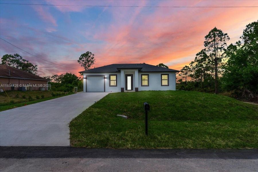 Front exterior of a new home in , Lehigh Acres, FL, highlighting curb appeal (Image 17). Front exterior of a new home in , Lehigh Acres, FL, highlighting curb appeal (Image 17).