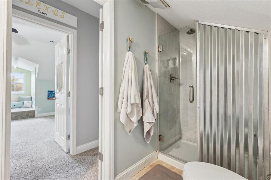 Bathroom featuring an enclosed shower