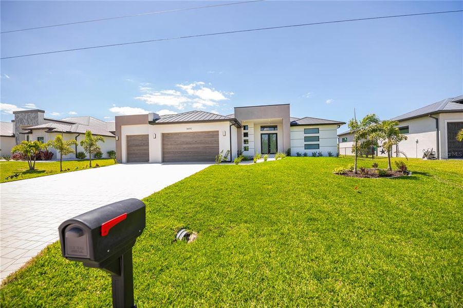 Front exterior of a new home in , Port Charlotte, FL, highlighting curb appeal (Image 30). Front exterior of a new home in , Port Charlotte, FL, highlighting curb appeal (Image 30).