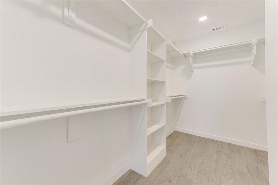 Walk in closet featuring light wood-type flooring