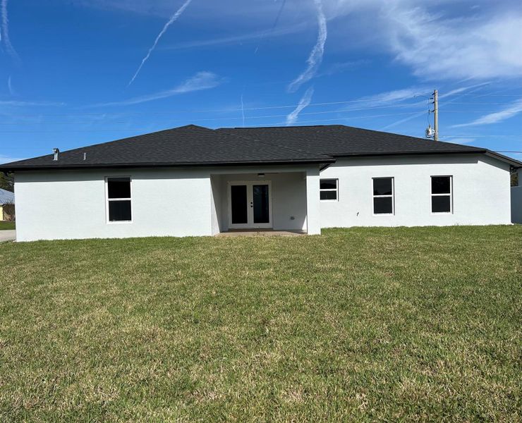 Front exterior of a new home in , Palm Bay, FL, highlighting curb appeal (Image 1). Front exterior of a new home in , Palm Bay, FL, highlighting curb appeal (Image 1).