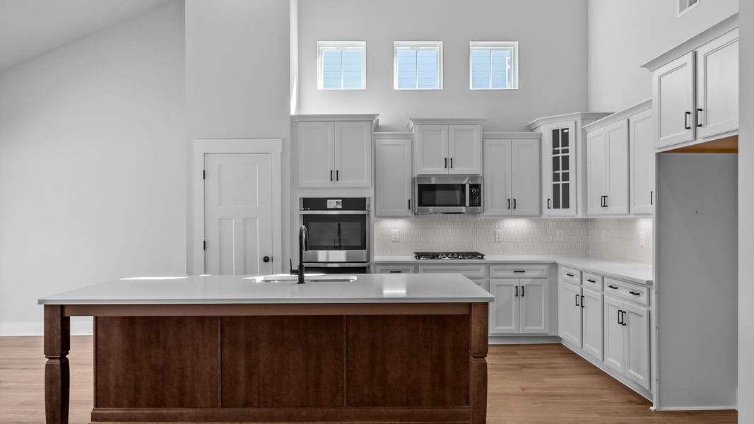 Accomplished layout with a first-class kitchen in this select community by DRB Homes