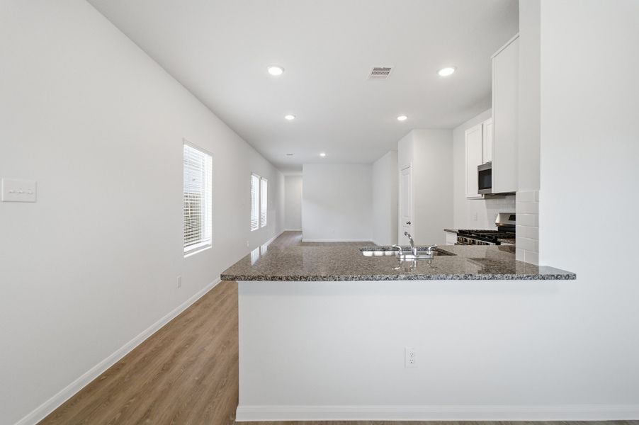 Furnished interior view inside a new home in The Pines at Seven Coves, Willis (Image 4).