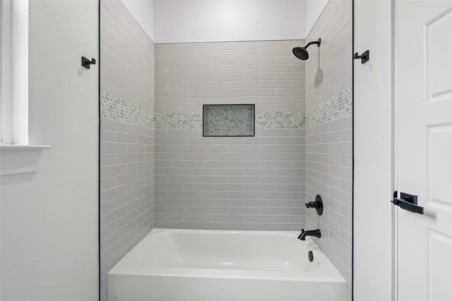 Full bathroom with shower / tub combination