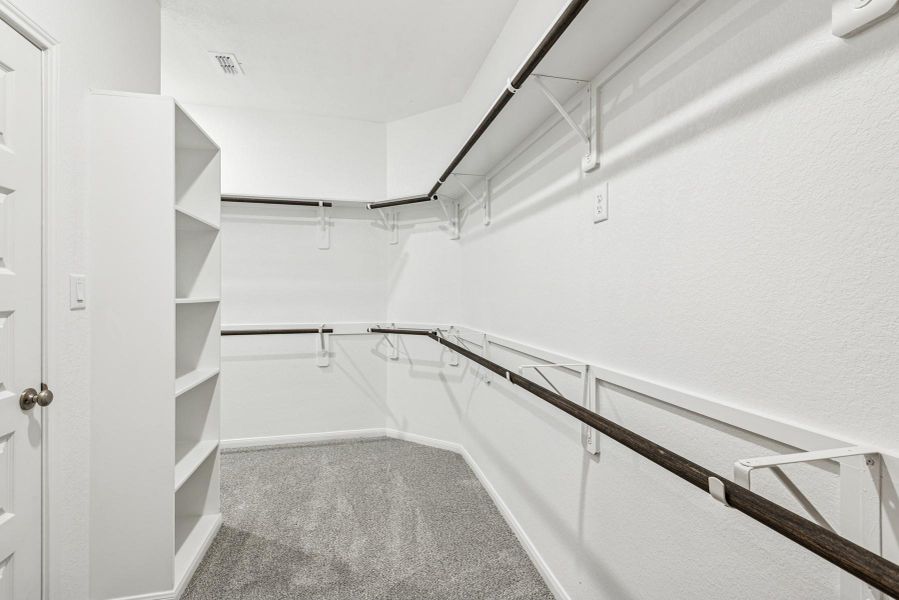 Walk-in closet in the owner's suite (*Photo not of actual home and used for illustration purposes only.)