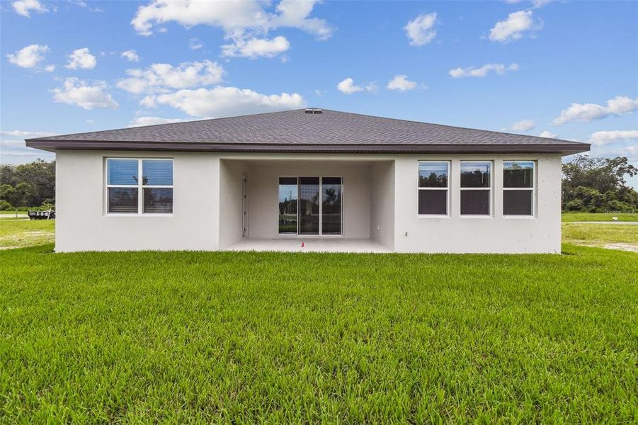 Front exterior of a new home in Hidden Ridge, New Port Richey, FL, highlighting curb appeal (Image 32). Front exterior of a new home in Hidden Ridge, New Port Richey, FL, highlighting curb appeal (Image 32).