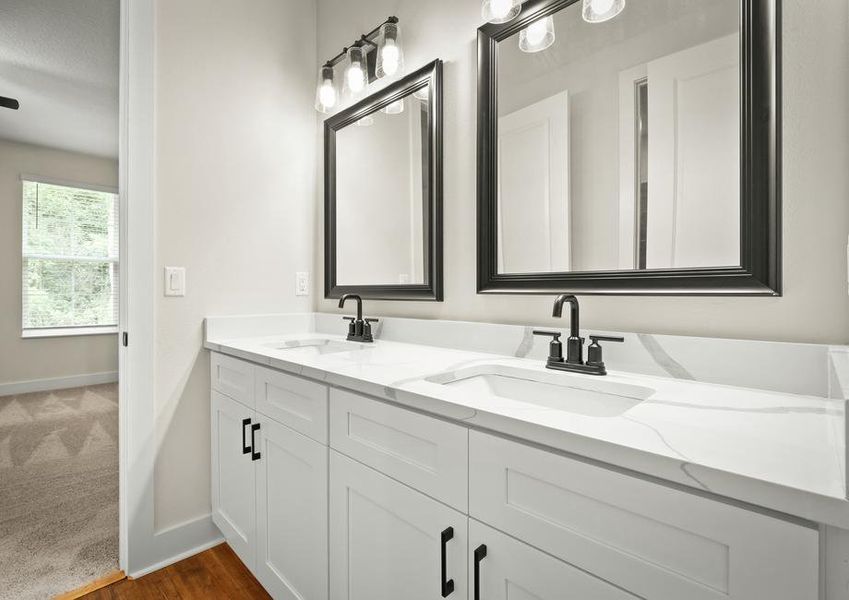 Large vanities are found in all bathrooms.