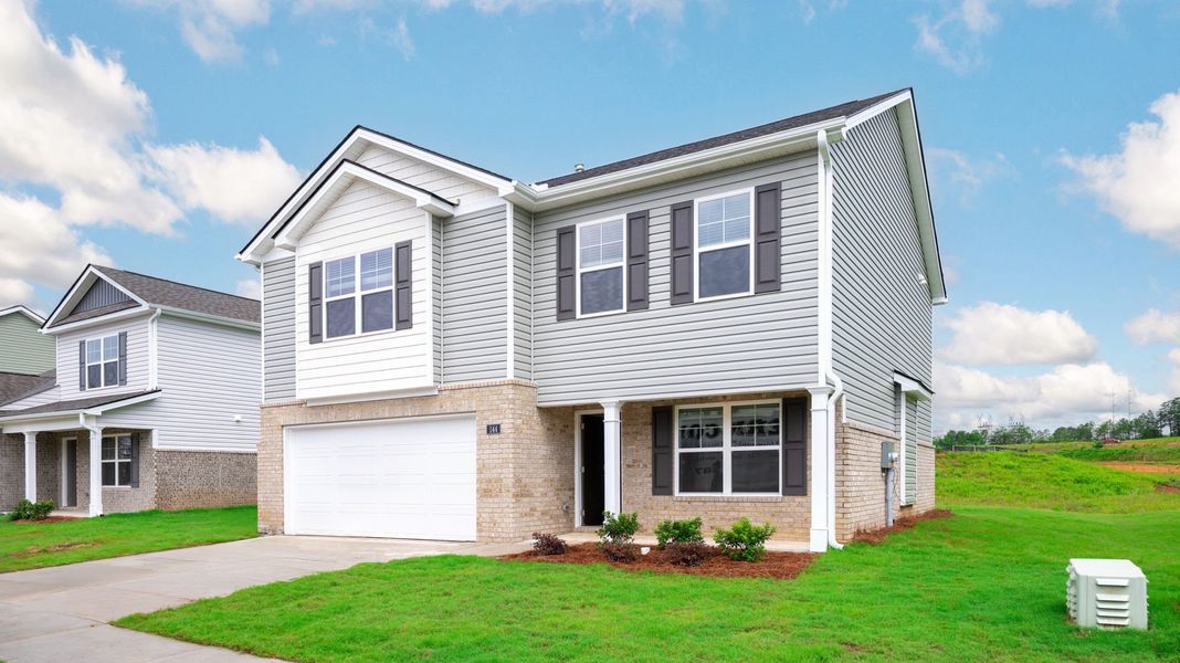 Front exterior of a new home in Price's Crossing, LaFayette, GA, highlighting curb appeal (Image 1).