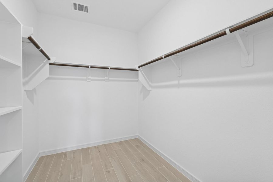 Primary walk-in closet (*Photo not of actual home and used for illustration purposes only.)