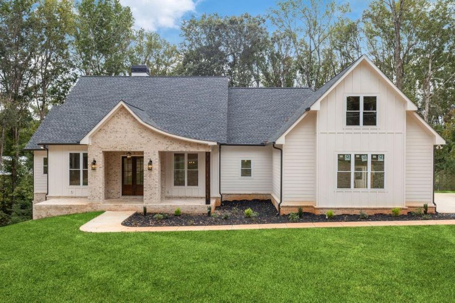 Front exterior of a new home in , Canton, GA, highlighting curb appeal (Image 1).