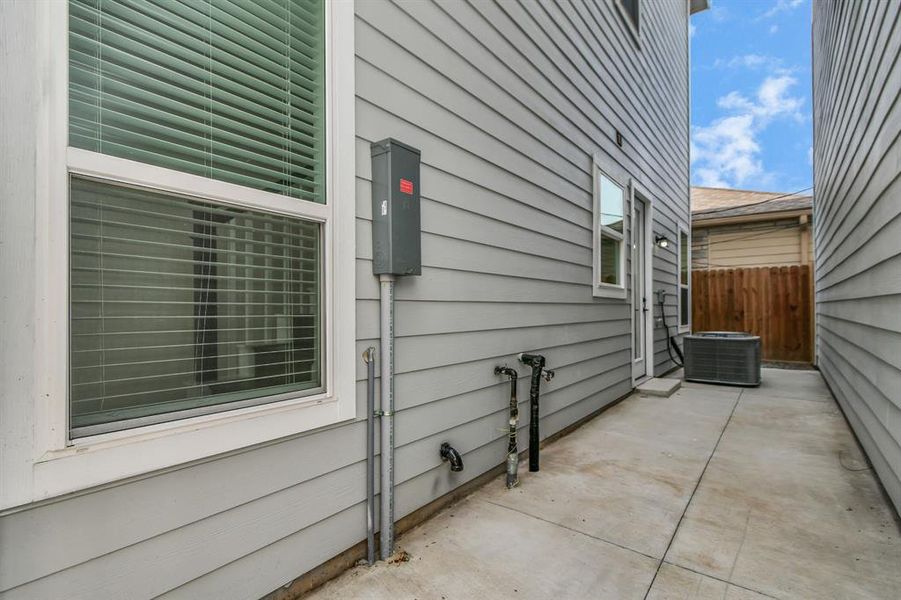 Embrace outdoor living in this side space, perfect for soaking fresh air, entertaining, or simply entering and exiting the side of the home.