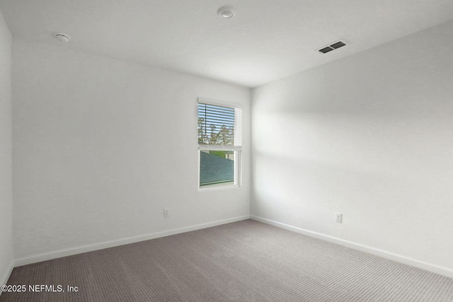 Spacious, unfurnished interior of a new home in Cordova Palms, St. Augustine (Image 39).