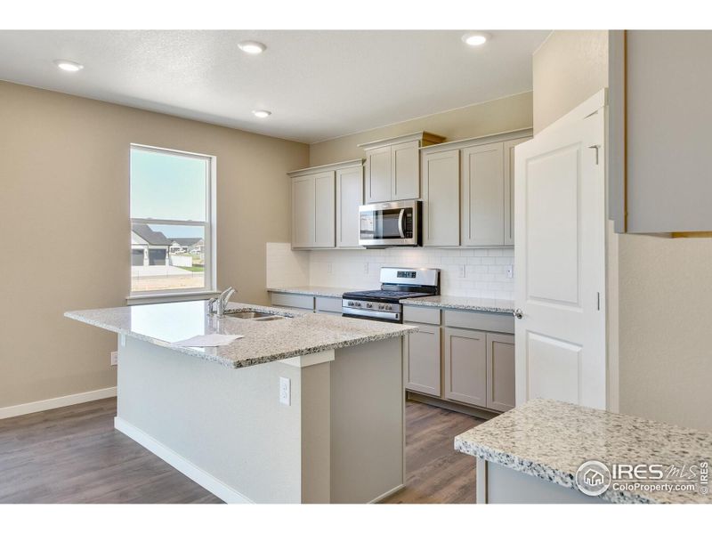 Furnished interior view inside a new home in Settlers Crossing, Commerce City (Image 7).