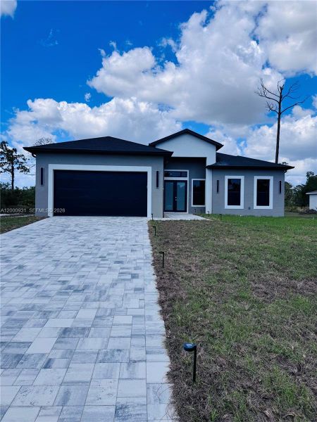 Front exterior of a new home in , Port Charlotte, FL, highlighting curb appeal (Image 24).