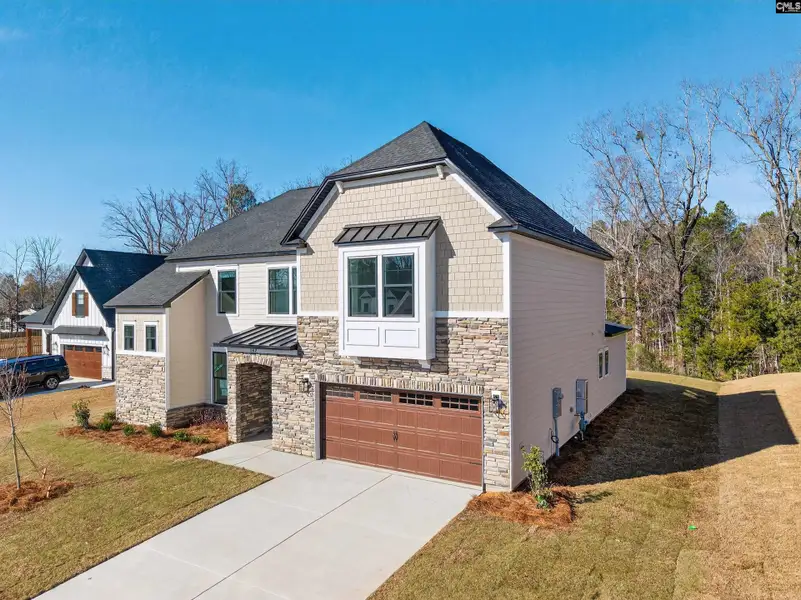 Front exterior of a new home in Collins Cove, Chapin, SC, highlighting curb appeal (Image 24).