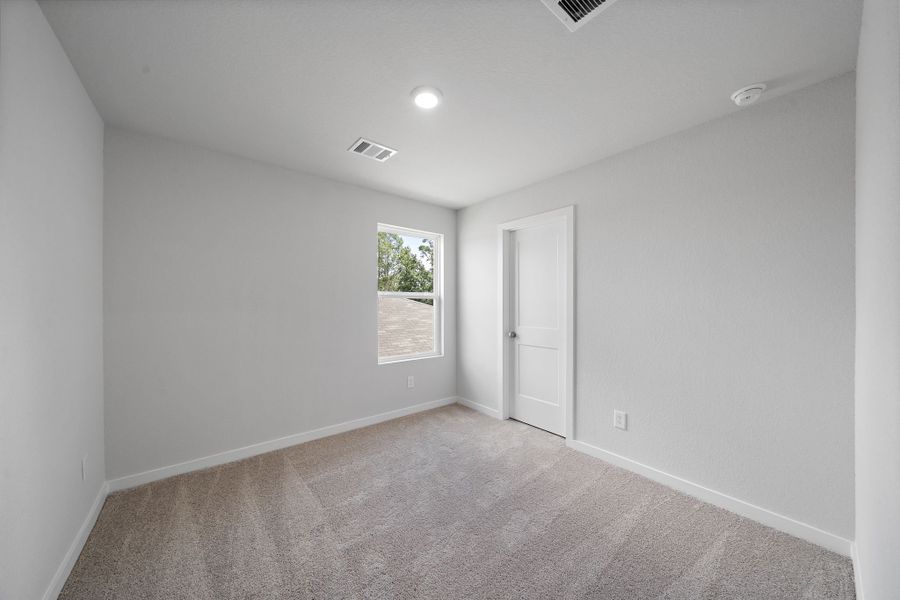 A room with a door and a window. A room with a door and a window.