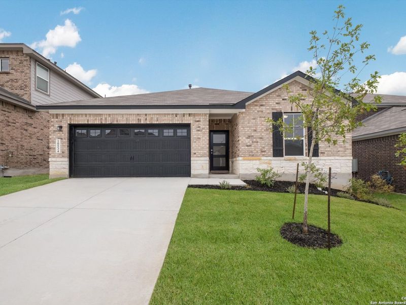 Front exterior of a new home in Bricewood, San Antonio, TX, highlighting curb appeal (Image 26).