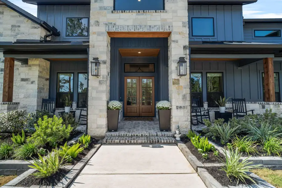 Beautiful entry with herringbone pattern brick on porch.