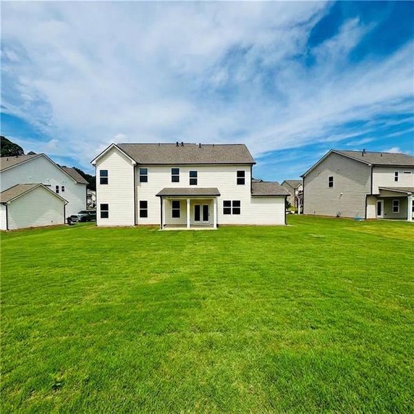 Exterior details and patio area of a home in Rosewood Lake Estates, Hoschton (Image 23).