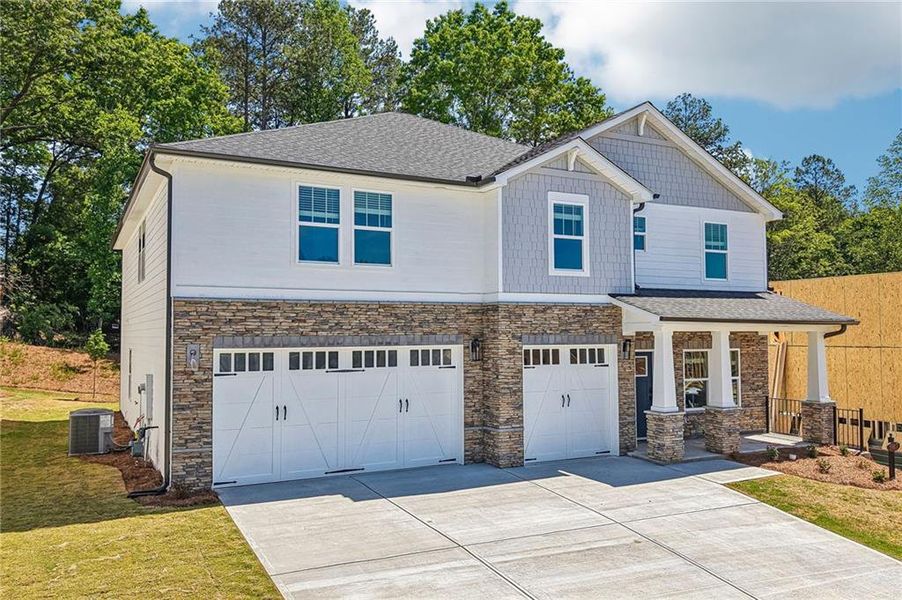 Front exterior of a new home in Vines at Mill Creek - Legacy Series, Braselton, GA, highlighting curb appeal (Image 2). Front exterior of a new home in Vines at Mill Creek - Legacy Series, Braselton, GA, highlighting curb appeal (Image 2).