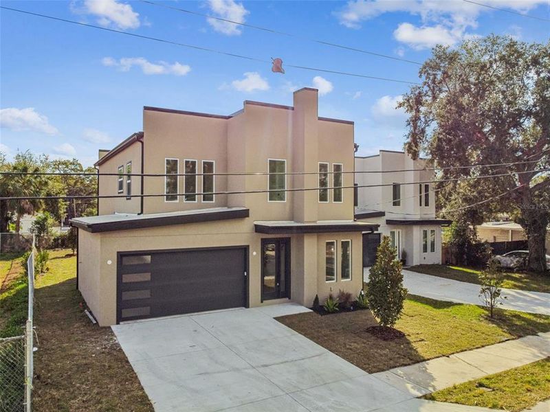 Front exterior of a new home in , Tampa, FL, highlighting curb appeal (Image 36).