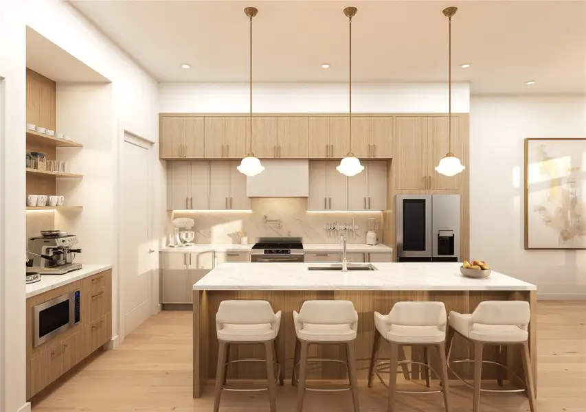 The cooking wall — pot filler over the gas cooktop, open shelving, under-cabinet lighting, all complete with an oversized island.