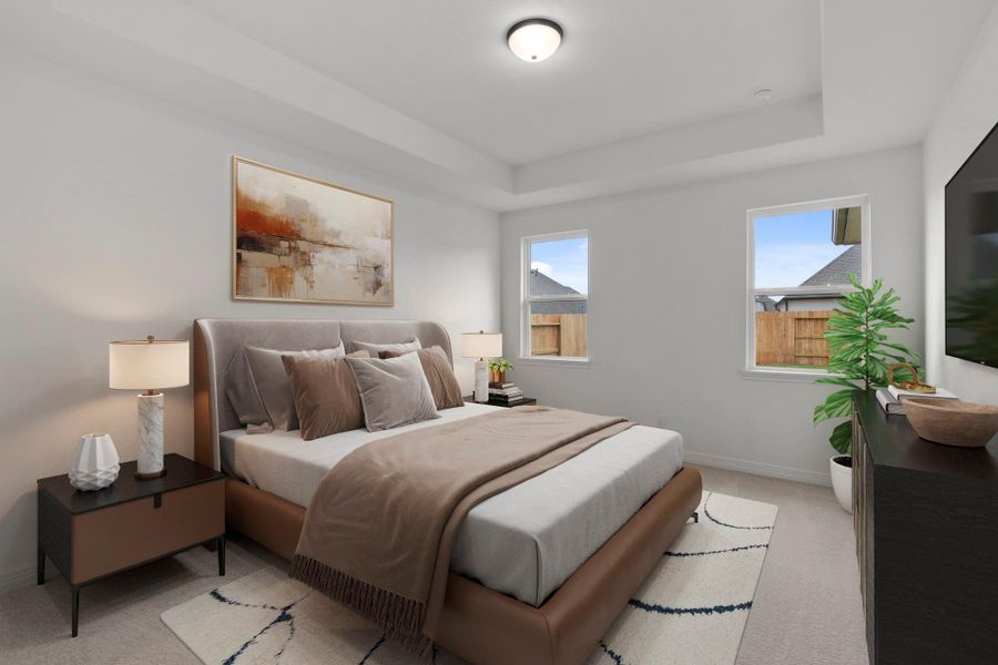 The primary bedroom is generously sized, creating a tranquil and spacious retreat that offers ample room for relaxation. Featuring plush carpet, high ceilings, fresh paint, and large windows that lets in natural lighting throughout the day.