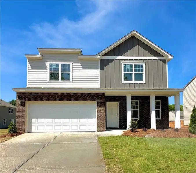 Front exterior of a new home in Mt. Tabor Ridge, Dallas, GA, highlighting curb appeal (Image 1). Front exterior of a new home in Mt. Tabor Ridge, Dallas, GA, highlighting curb appeal (Image 1).